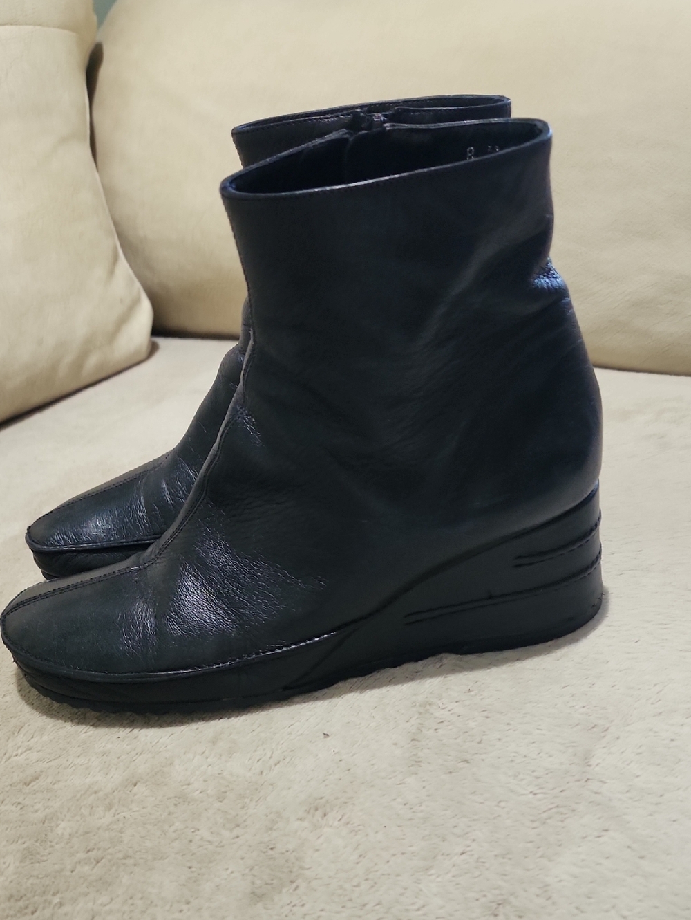 Women’s Via Spiga black leather wedge ankle boots.